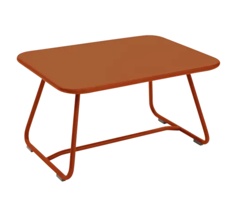 Load image into Gallery viewer, Candied orange Fermob Sixties low outdoor table with 76x55.5cm round surface, ideal for patio or garden seating areas.
