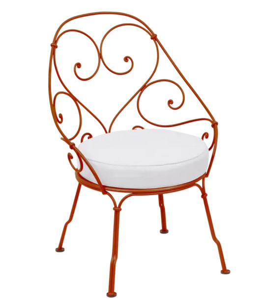 Candied Off White Fermob Cabriolet outdoor armchair with metal frame, stylish and comfortable outdoor furniture.