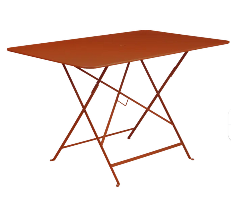Load image into Gallery viewer, Fermob foldable bistro table in candied orange color, 117x77 cm, outdoor metal furniture, with a sleek and compact design
