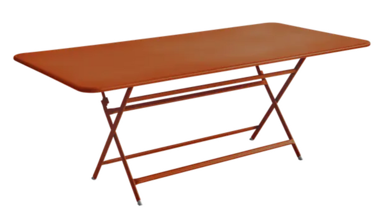 Load image into Gallery viewer, Foldable Fermob Caractère outdoor table in orange, 190x90 cm, eight-seater with a sleek, modern design.
