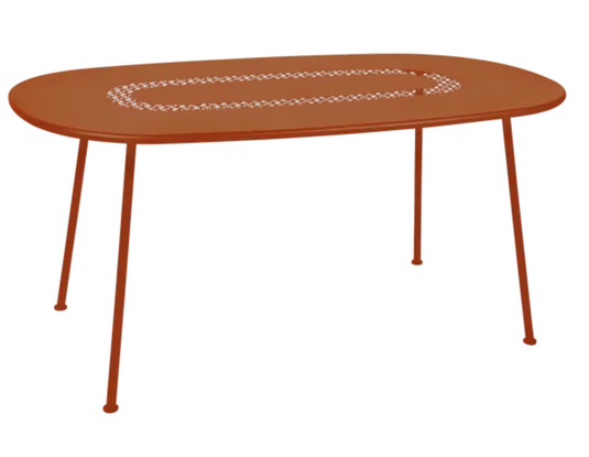 Fermob LORETTE oval metal outdoor table in candied orange finish, 160x90 cm, suitable for dining and outdoor use.