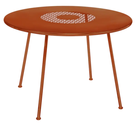 Fermob Lorette round metal garden table with 110cm diameter, orange color, fire-resistant, perfect for outdoor patio or garden.