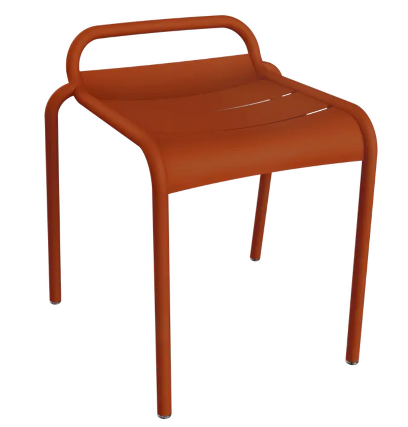 Load image into Gallery viewer, Fermob Luxembourg outdoor dining stool with candied orange color and sleek modern design for outdoor furniture.
