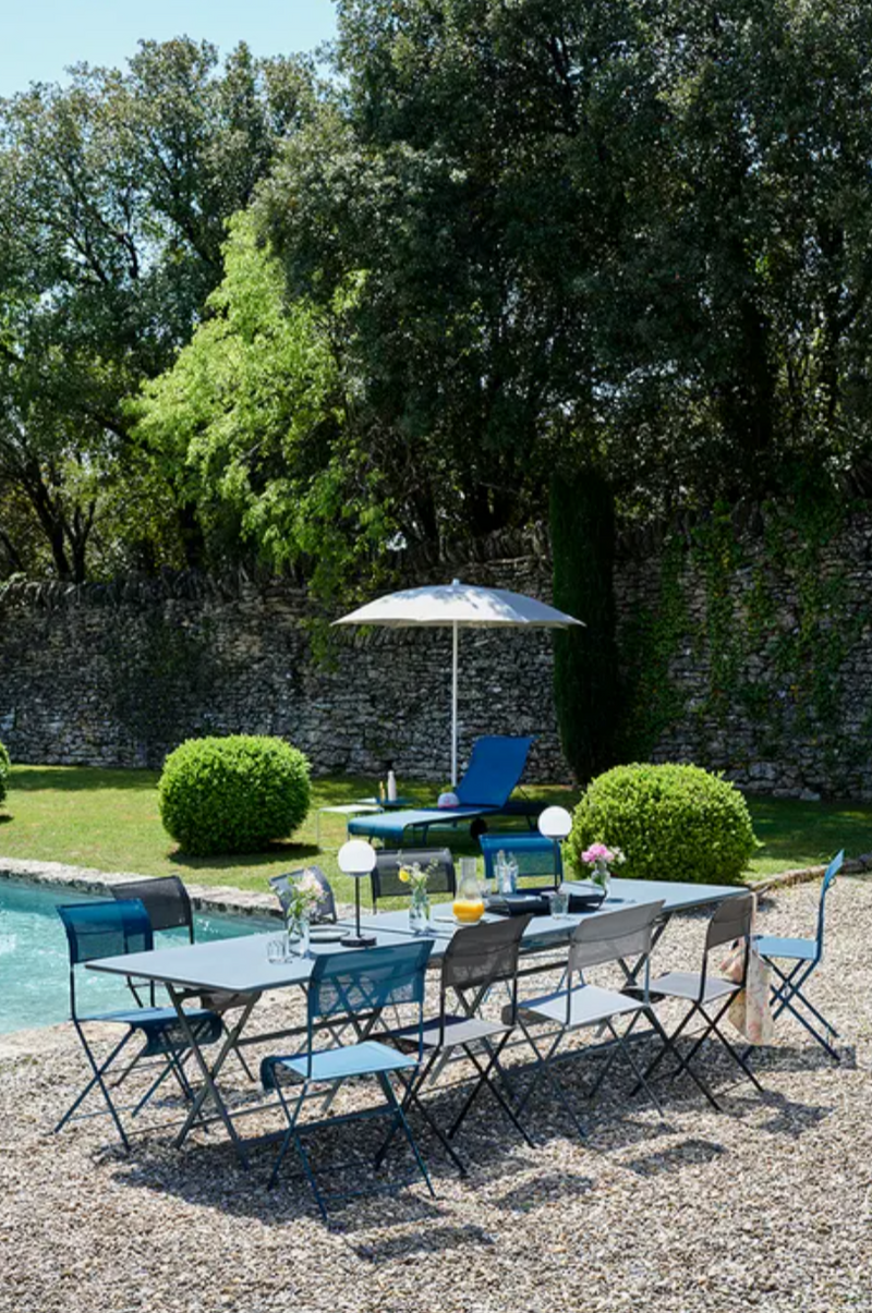Load image into Gallery viewer, Fermob Caractère foldable outdoor table, 190 x 90 cm, eight-seater, with sturdy design and wood finish for outdoor dining.
