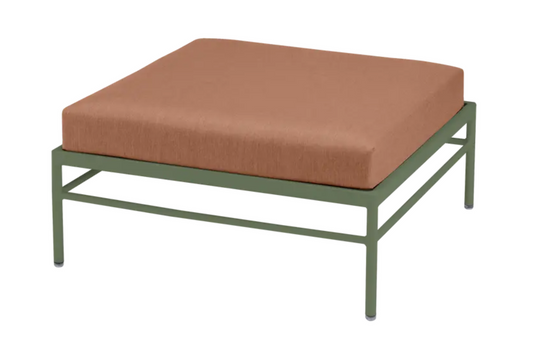 Fermob Rivage outdoor ottoman with peach cushion, metal frame, and modern lounge design for outdoor patio use.
