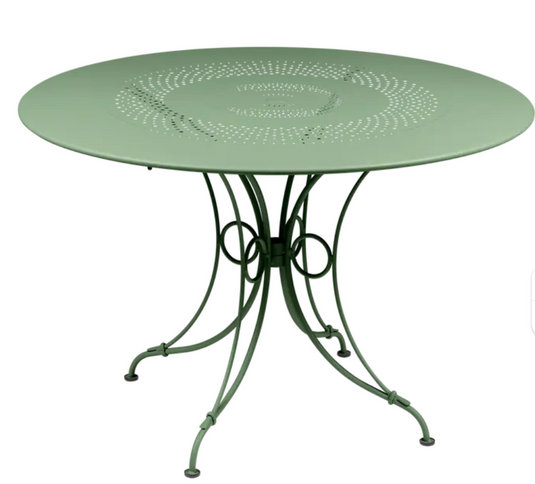 Fermob 1900 outdoor round table with 117cm diameter, metal design, suitable for patio or garden use.