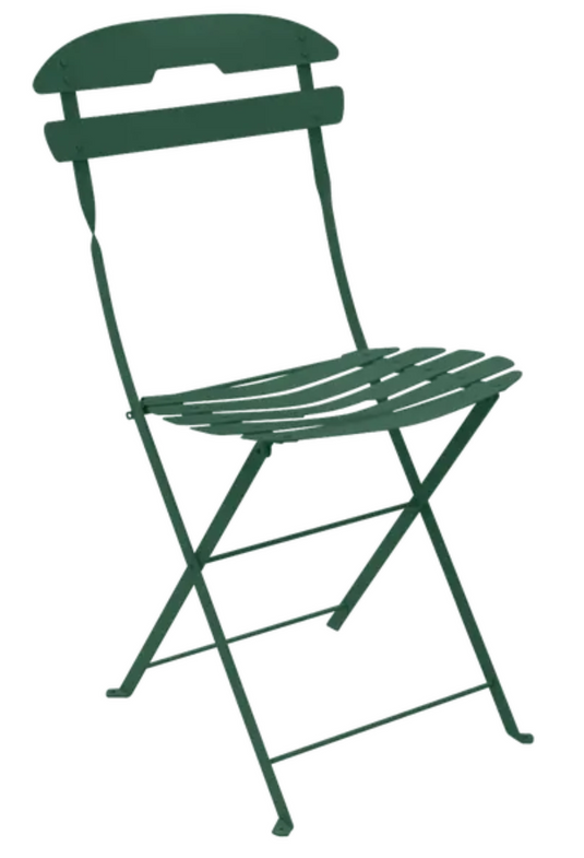 Fermob La Môme cedar green folding chair, lightweight and stylish outdoor patio furniture, shown in a foldable position.