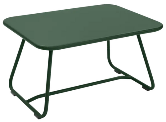 Cedar green Fermob Sixties low outdoor table measuring 76x55.5cm, featuring a sleek, modern design for patio or garden use.