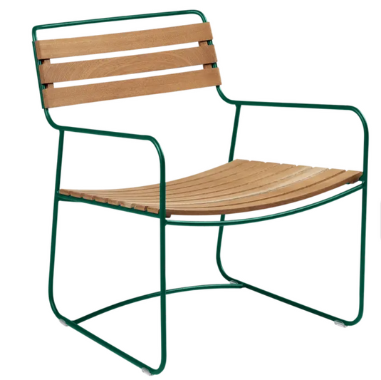 Green Fermob metal low armchair with sleek design, outdoor cedar-green finish, suitable for garden or patio seating.