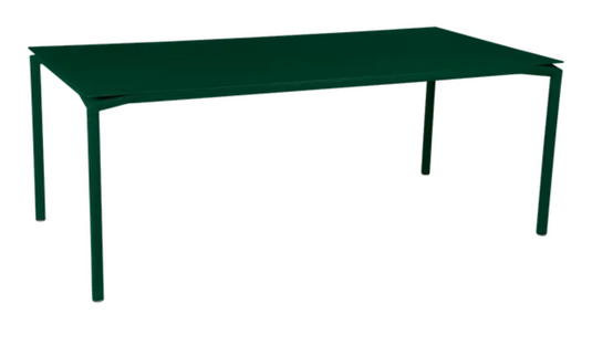 Fermob Calvi outdoor rectangular dining table in cedar green, 195 x 95 cm, suitable for outdoor and indoor use.