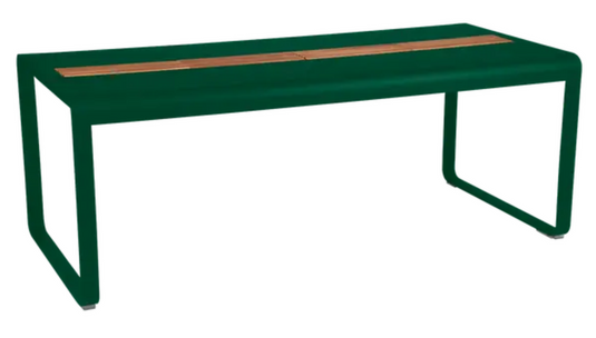 Fermob Bellevie outdoor dining table in cedar green with wood and metal design, 196x90 cm, includes built-in storage for outdoor use.