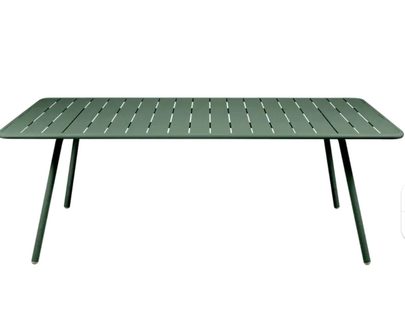 Load image into Gallery viewer, Cedar green Fermob Luxembourg outdoor table, 207x100 cm, with a sleek rectangular design for outdoor dining and patio use.
