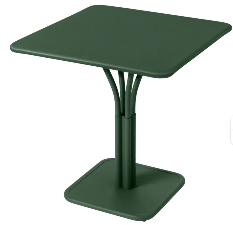 Load image into Gallery viewer, Luxembourg Fermob metal outdoor table in cedar green with a solid top, perfect for patio or restaurant settings.
