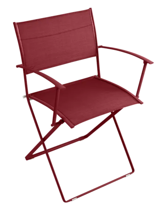 Fermob Plein Air Armchair folding chair in vibrant chili color, lightweight and stylish outdoor seating for patio or garden.