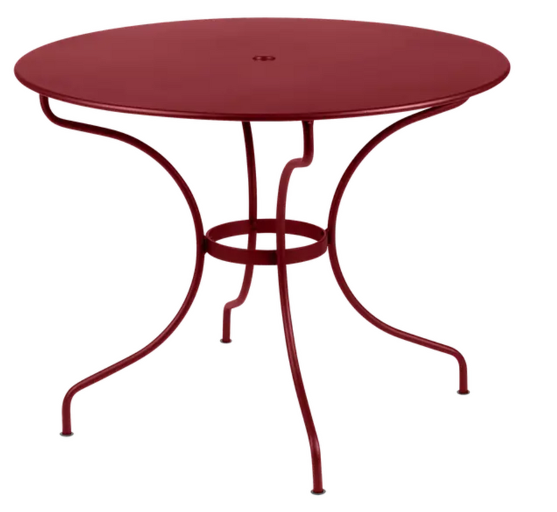 Load image into Gallery viewer, Fermob OPÉRA+ outdoor metal table in chili red with a 96cm diameter, designed for five-seater outdoor patio use.
