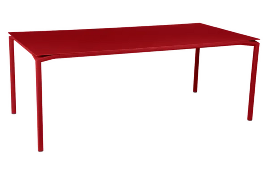 Fermob CALVI rectangular outdoor dining table, 195x95 cm, eight-seater, suitable for indoor and outdoor use, in vibrant red.
