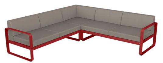 Fermob Bellevie Composition 2 modular outdoor lounge sofa set with grey, taupe, and chili cushions on a patio.