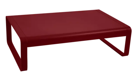 Fermob Bellevie low lounge table in red metal, measuring 103x75 cm, outdoor coffee table with sleek design.
