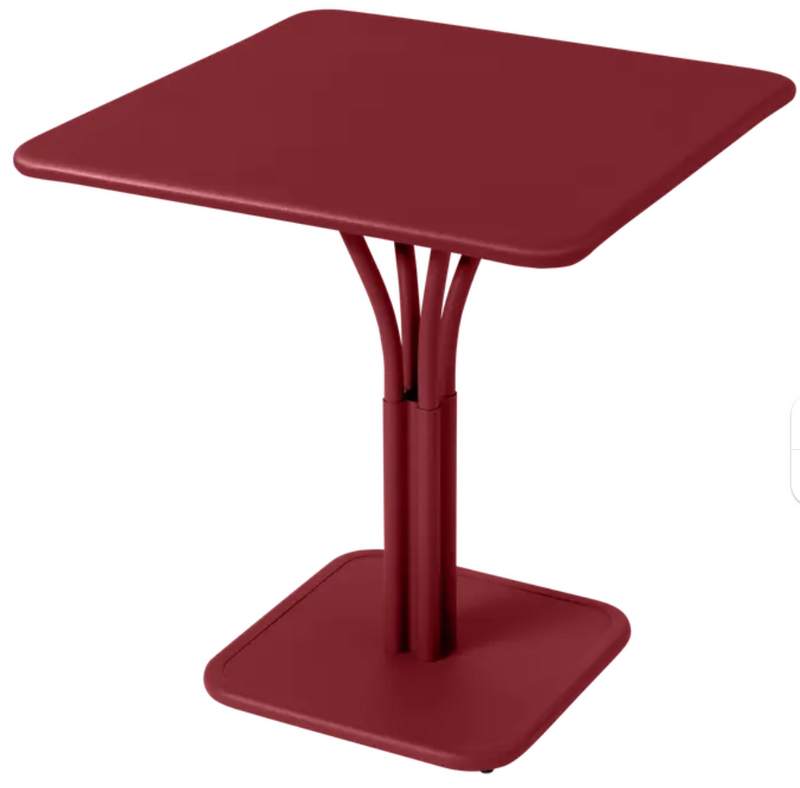 Load image into Gallery viewer, Fermob Luxembourg metal outdoor table with a solid top, 71x71 inches, suitable for patio or restaurant outdoor seating.
