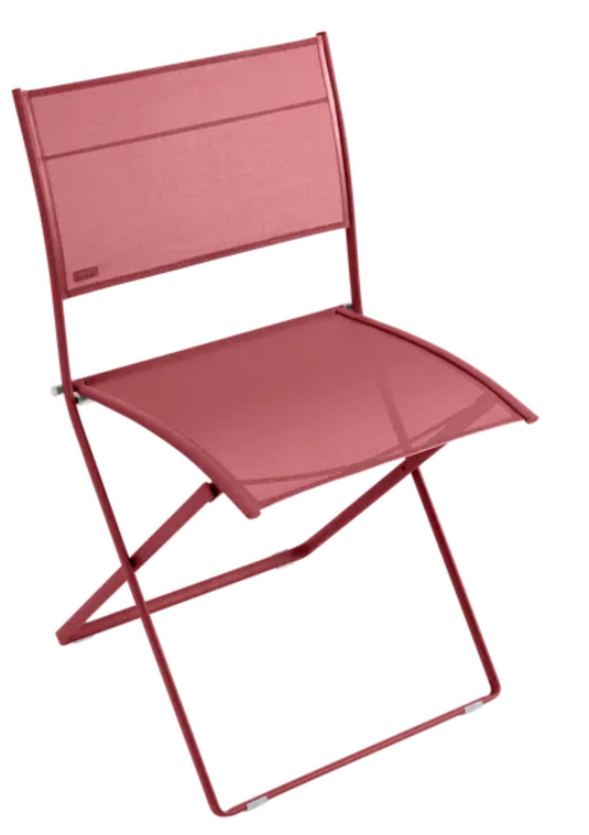 Fermob Plein Air Chair OTF, a red folding outdoor chair with a metal frame and fabric seat, ideal for patio or garden use.