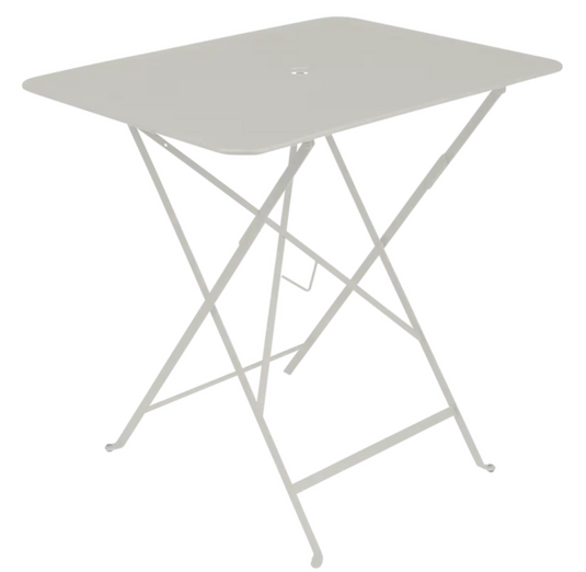 Clay grey Fermob foldable bistro table, 77x57 cm, metal outdoor furniture with a compact, portable design for outdoor dining.