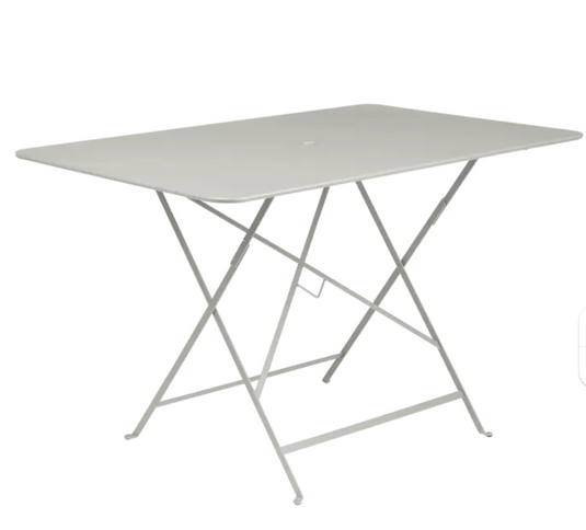Clay grey Fermob foldable bistro table with 117 x 77 cm metal surface, suitable for outdoor patio or garden use.
