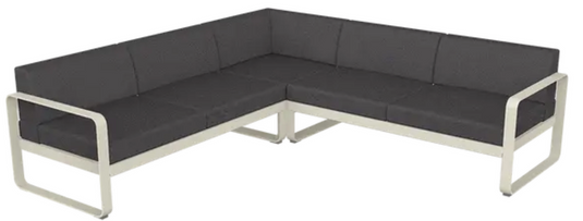 Fermob Bellevie Composition 2 outdoor lounge sofa set with clay, grey, and graphite cushions on a patio.