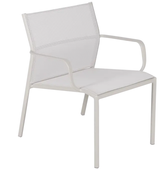 Clay grey Fermob Cadiz low outdoor armchair with aluminum frame and technical fabric seat, suitable for garden or patio spaces.