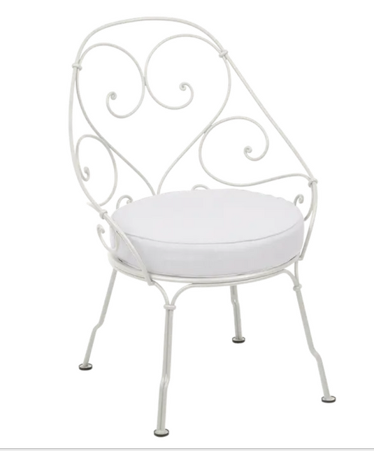 Clay grey Fermob Cabriolet outdoor armchair with off-white cushions, metal frame, stylish and comfortable for outdoor seating.