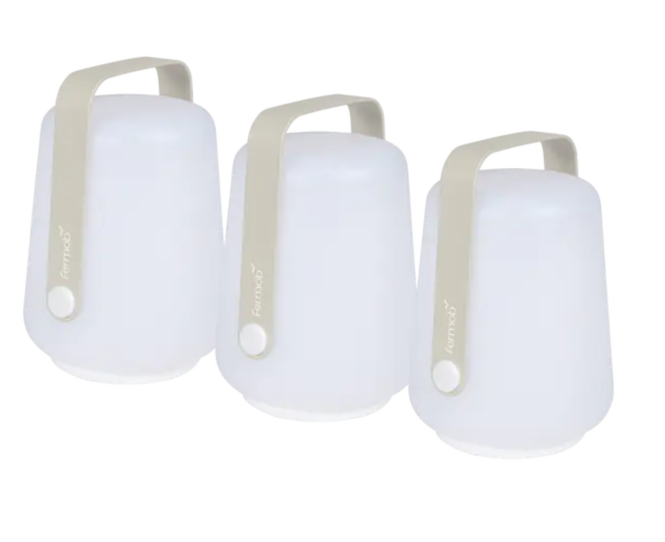 Set of three Fermob outdoor mini lamps, small round ballads in grey, 12 cm height, ideal for outdoor lighting.