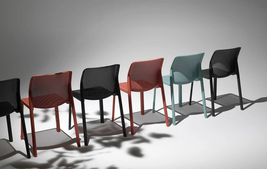 Nardi Corallo Bit outdoor chair with a woven seat and backrest, made of durable plastic, ideal for patio or garden use.