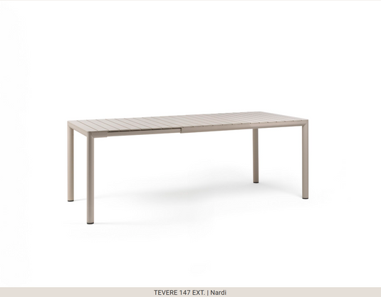 Nardi Tevere 147 extensible outdoor table by Custom Wood Designs, featuring wood surface and metal legs, set outdoors.