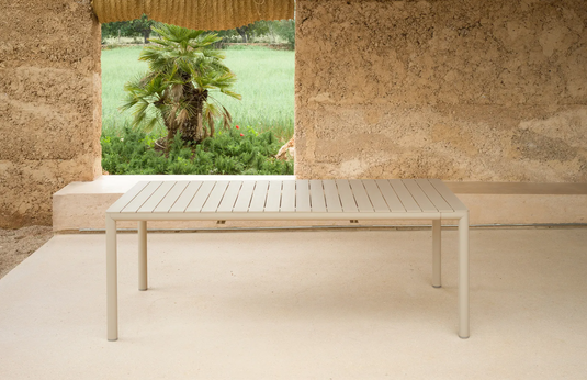 Nardi Tevere 210 extendable outdoor table with a sleek wooden surface and sturdy legs, ideal for outdoor dining and gatherings.