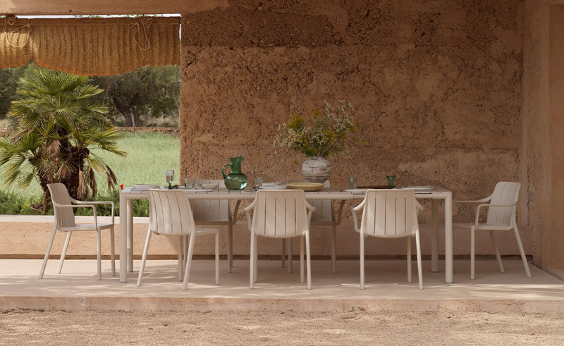 Load image into Gallery viewer, Nardi Tevere 210 extendable outdoor table with a sleek wooden surface and sturdy metal legs, suitable for outdoor dining.
