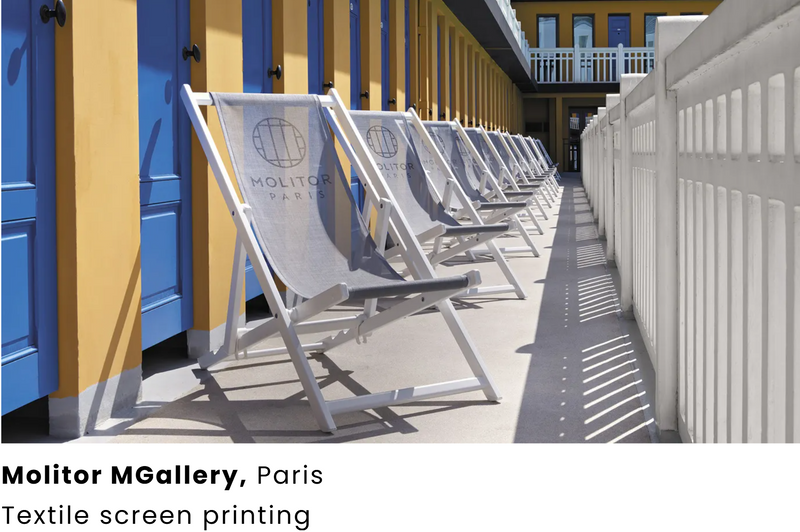 Load image into Gallery viewer, Fermob ALPINA folding deck chair with wooden and aluminum frame, featuring custom printed fabric for outdoor relaxation.
