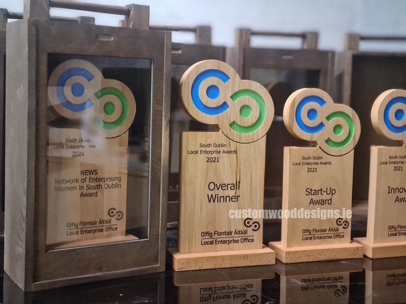 Load image into Gallery viewer, Custom Wood Designs awards with engraved local enterprise awards 2021 logo on polished wooden plaques.
