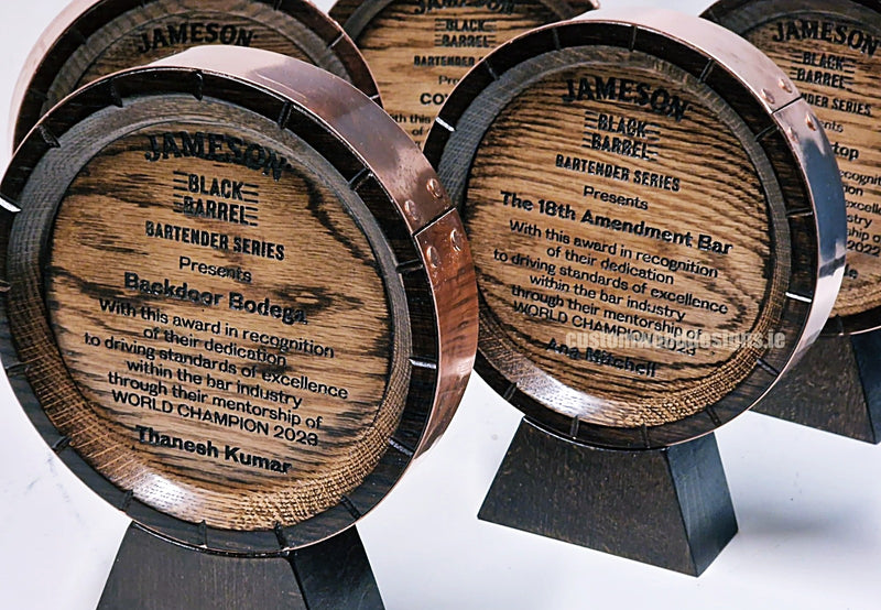 Load image into Gallery viewer, Custom Wood Designs awards featuring dark wood finish and engraved details, designed for corporate recognition and Irish distillery events.
