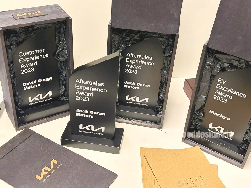 Load image into Gallery viewer, Custom Wood Designs corporate awards featuring wooden plaques with engraved KIA Motors branding for Ireland's 2023 business recognition.
