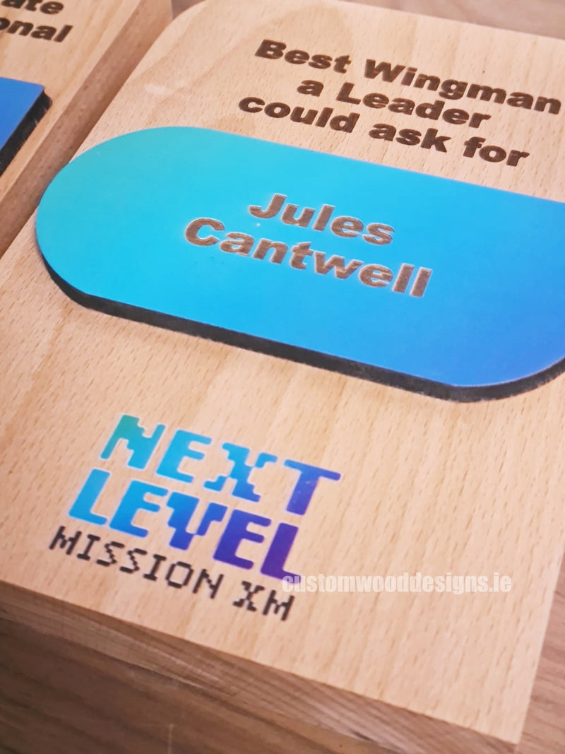 Load image into Gallery viewer, Custom Wood Designs custom awards with engraved plaques, featuring elegant wood finish and intricate detailing, displayed on a wooden surface.
