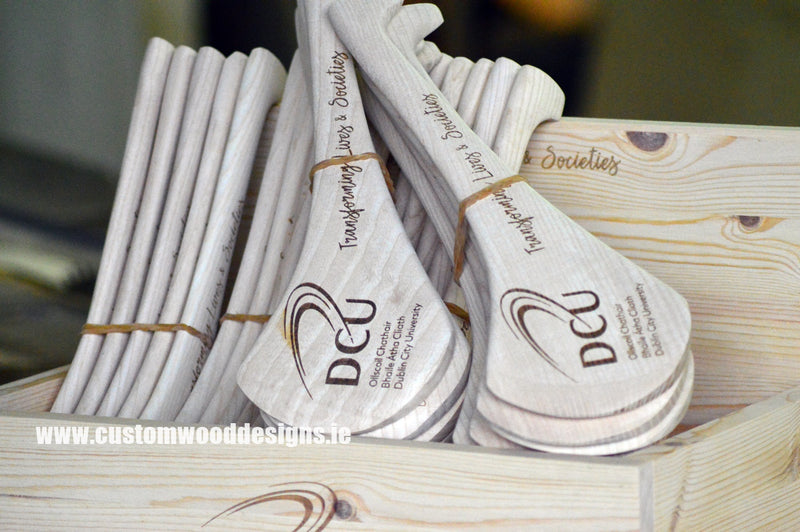 Load image into Gallery viewer, Laser-engraved wooden sports trophies by Custom Wood Designs, featuring hurling award with Dublin branding.
