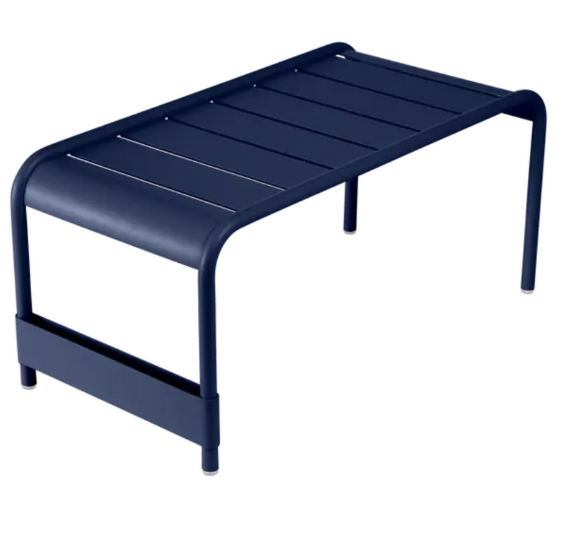Load image into Gallery viewer, Deep blue Fermob Luxembourg large low table bench measuring 86x44, with a sleek, modern design and smooth wooden surface.
