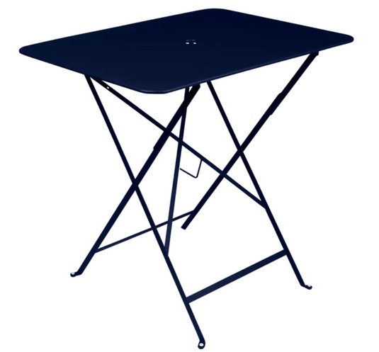 Deep blue Fermob foldable bistro table measuring 77x57 cm, outdoor metal furniture with a sleek, compact design for outdoor dining.