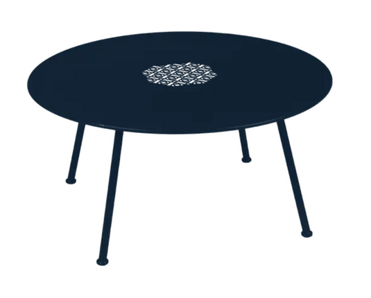 Deep blue Fermob Lorette low metal coffee table with white accents, 80cm diameter, outdoor fire-resistant design.