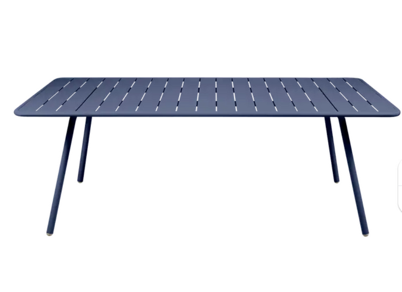 Load image into Gallery viewer, Deep blue Fermob Luxembourg outdoor table, 210x100 cm, with sleek design and sturdy metal construction for outdoor dining.

