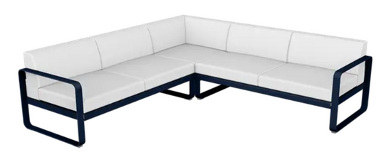 Deep blue and off-white Fermob Bellevie outdoor sofa composition with modular design for stylish outdoor lounging.