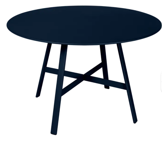 Deep blue Fermob SO'O oval oak table with 117cm diameter, suitable for restaurant or hotel settings.