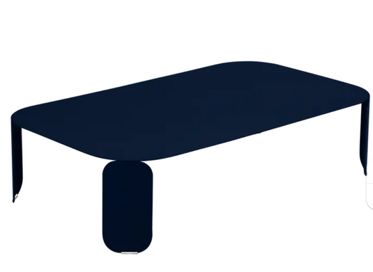 Deep blue Fermob Bebop low outdoor table, 120x70 cm with 42 cm height, designed for stylish outdoor furniture.