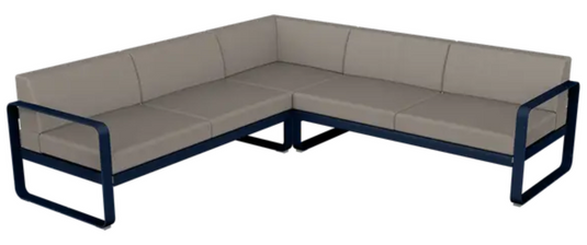 Fermob Bellevie Composition 2 outdoor modular sofa set with deep blue, grey, and taupe cushions arranged for outdoor lounging.