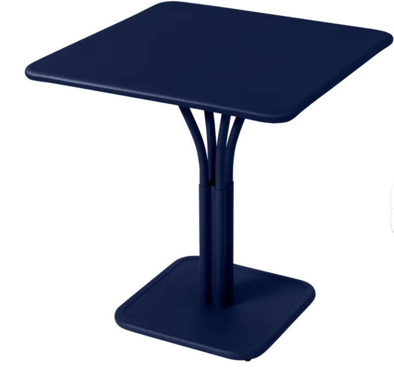 Load image into Gallery viewer, Deep blue Fermob Luxembourg metal pedestal table with a solid aluminum top, ideal for outdoor restaurant or patio use.
