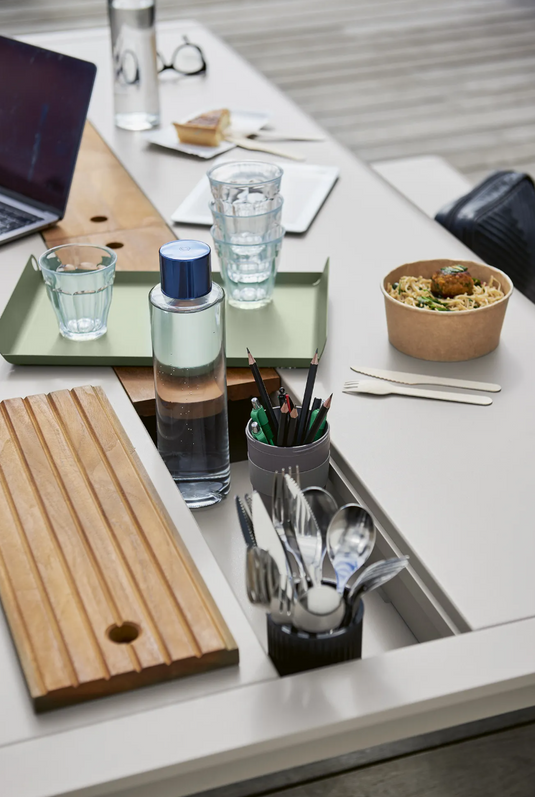 Fermob Bellevie outdoor dining table, 196 x 90 cm, with wood and metal construction, eight-seater with built-in storage.